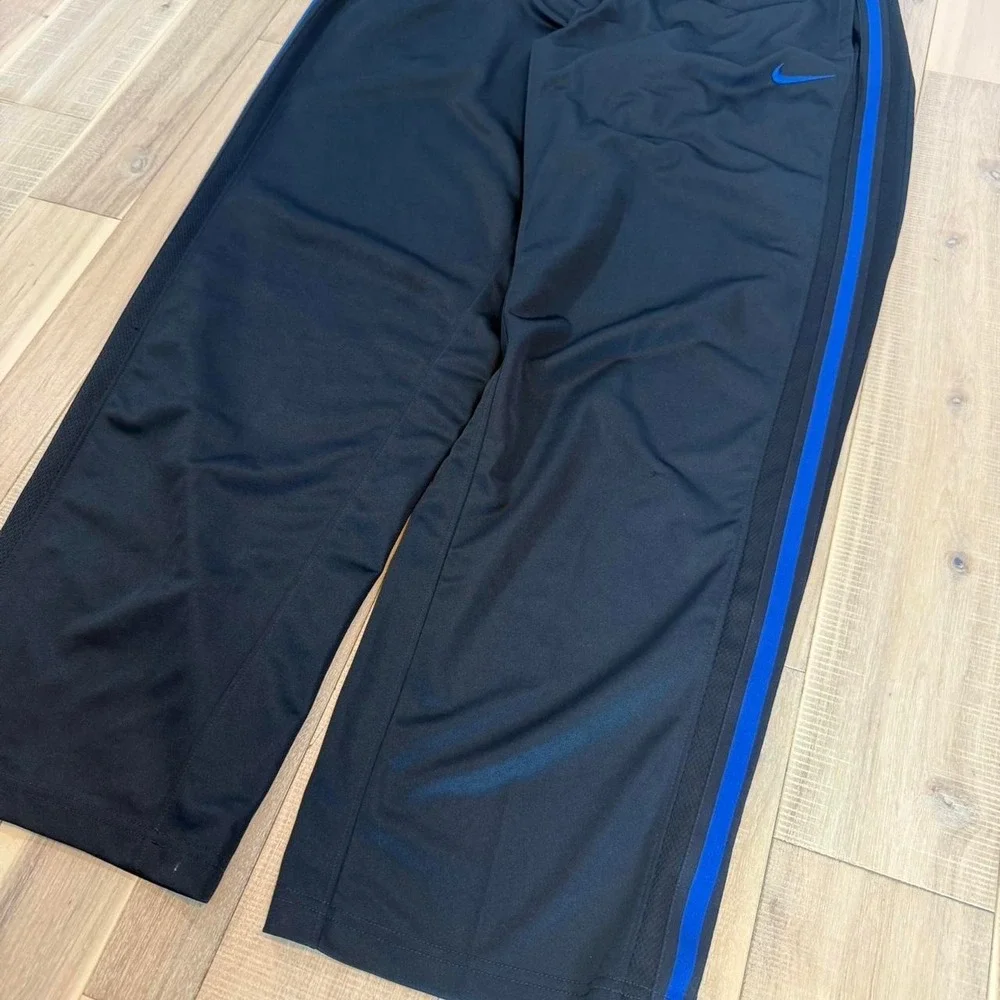 2000s baggy Nike black track pants with blue stripe sz XL